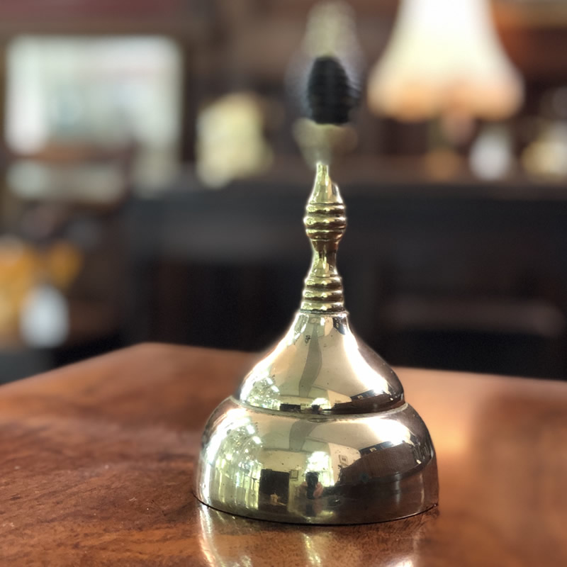Victorian brass table bell with turned wooden beehive handle.